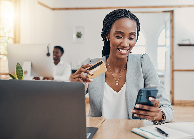 Photo of Woman Paying with Credit Cards