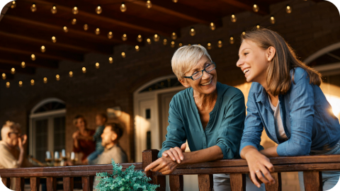A grandmother talking to her granddaughter.