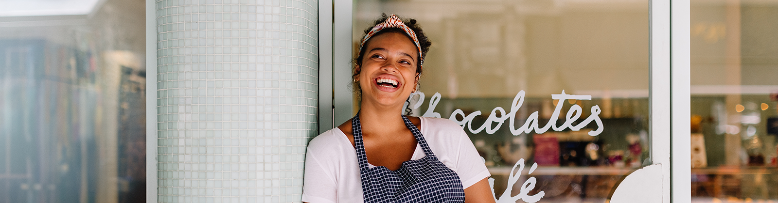 Photo of a woman outside of her cafe