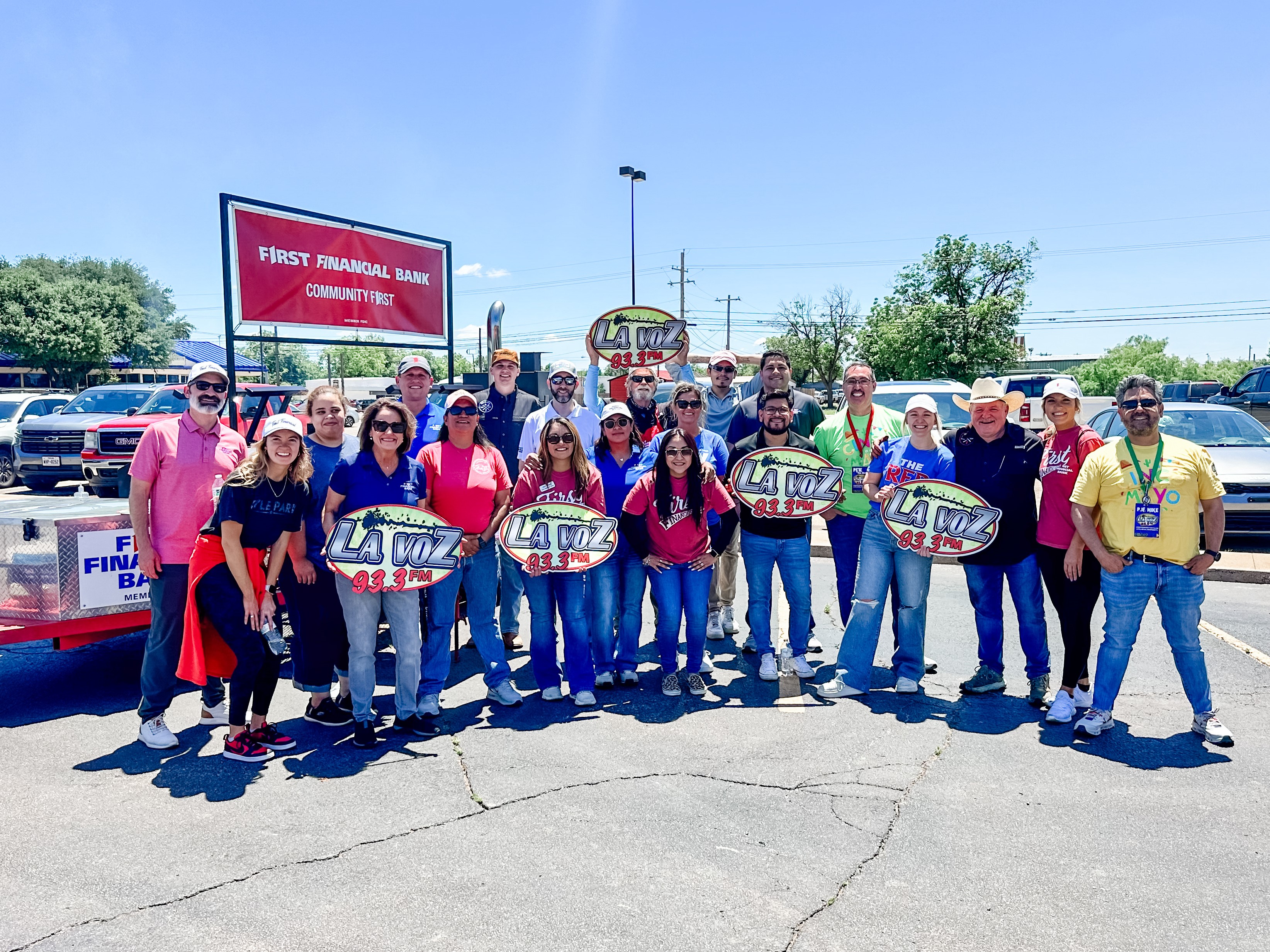 Group photo with La Voz radio station from our Cinco de Mayo event