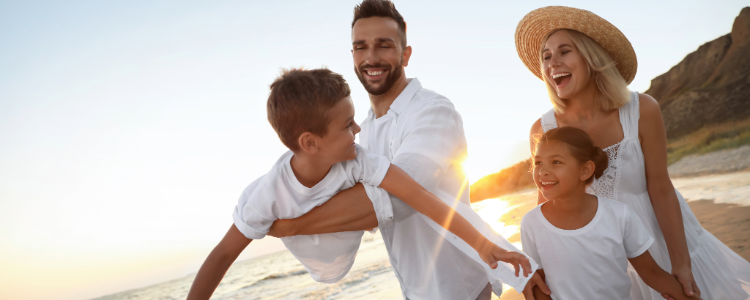 Photo of a family playing on the beach
